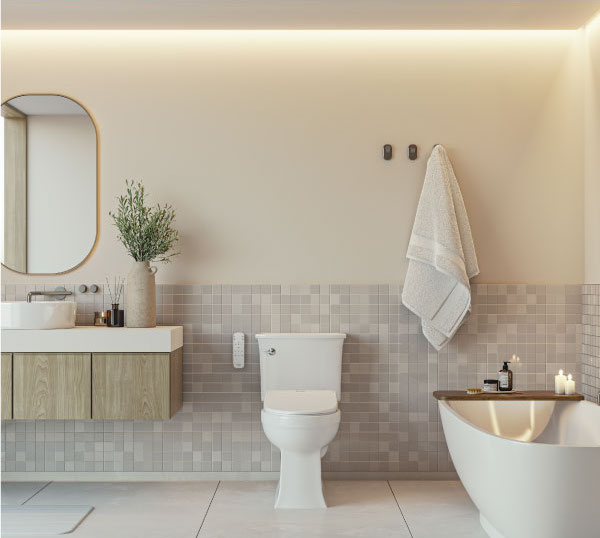 Modern, minimalist bathroom with Brondell Luxury Bidet seat installed next to a large soaking tub with candles and lavender plant accents.