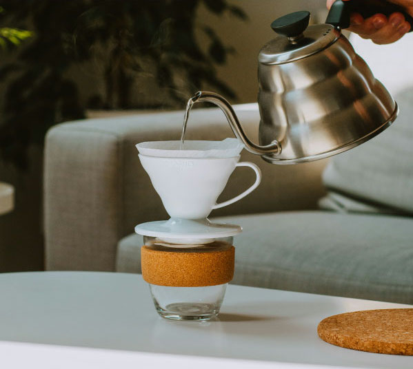 Person making a pour over coffee