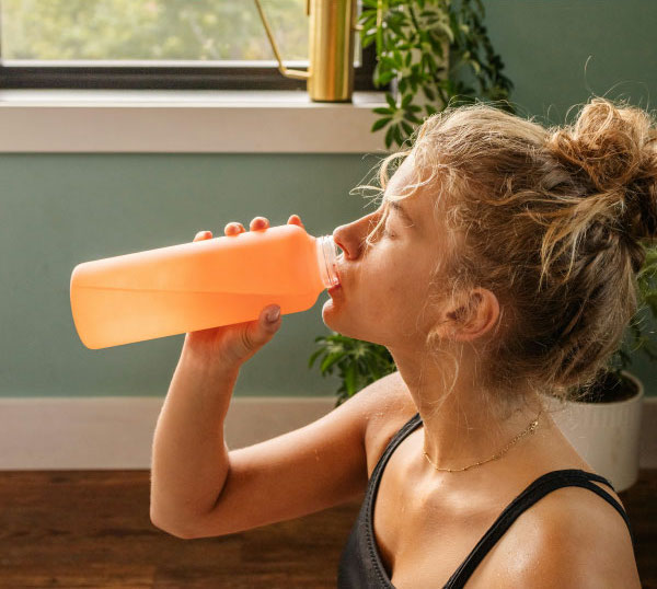 Woman drinking fresh filtered water.