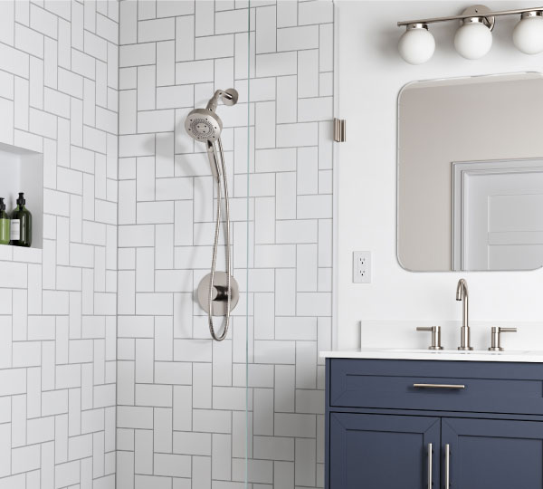 Nebia Yuba 5-Setting Handshower with HaloNetic Double Docking System installed modern bathroom with a blue vanity.