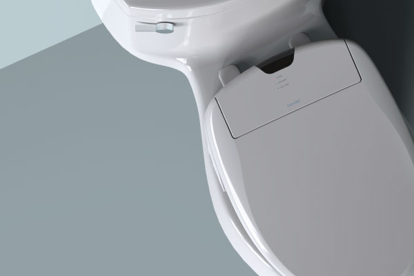 Modern toilet with integrated brondell bidet seat featuring a right-side control panel, shown closed in a clean, minimalist bathroom setting.