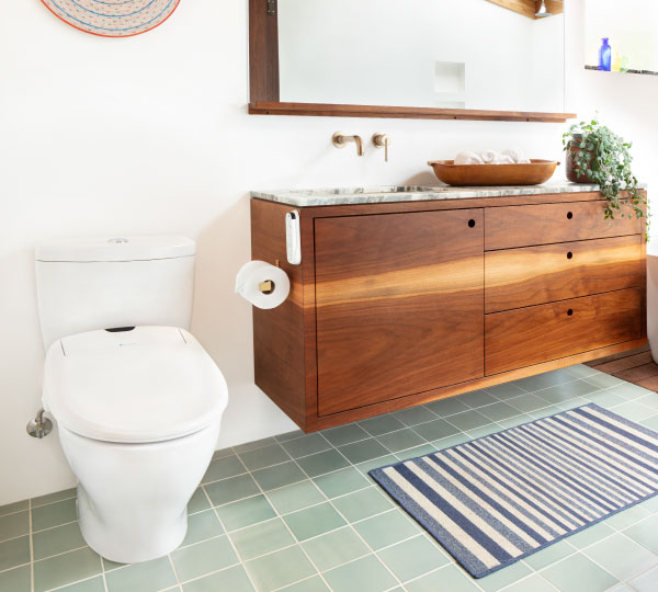 Modern bathroom with Swash 1400 Luxury Bidet Toilet Seat-sleek white design, advanced bidet features, beside wood vanity and large mirror for a spa-like feel.