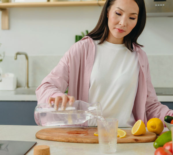 Coral Under Sink Water Filtration System installed beneath a kitchen sink, featuring multi-stage filters that provide clean, great-tasting filtered water directly from a dedicated faucet.