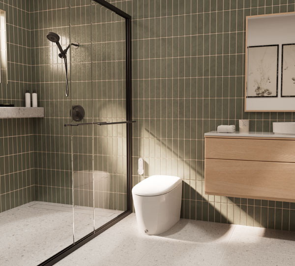 Coit Integrated Smart Bidet Toilet in a contemporary bathroom with green tile walls, glass shower enclosure, floating vanity, and clean, minimalist styling.