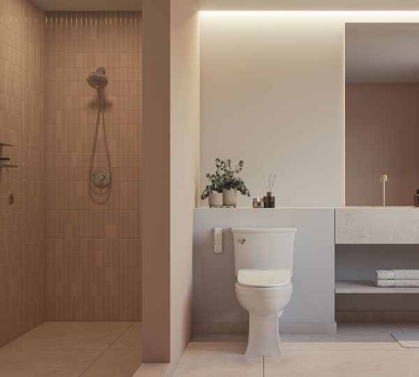 Coit Integrated Smart Bidet Toilet in a contemporary bathroom with green tile walls, glass shower enclosure, floating vanity, and clean, minimalist styling.