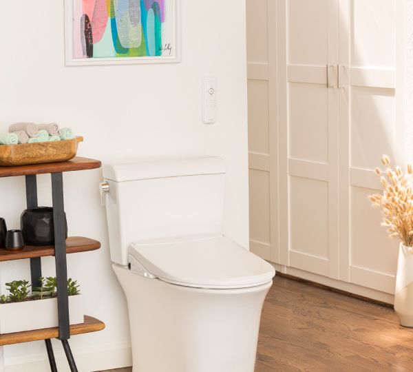 Swash Thinline T44 Luxury Bidet Toilet Seat on a white toilet in a sunlit bathroom.